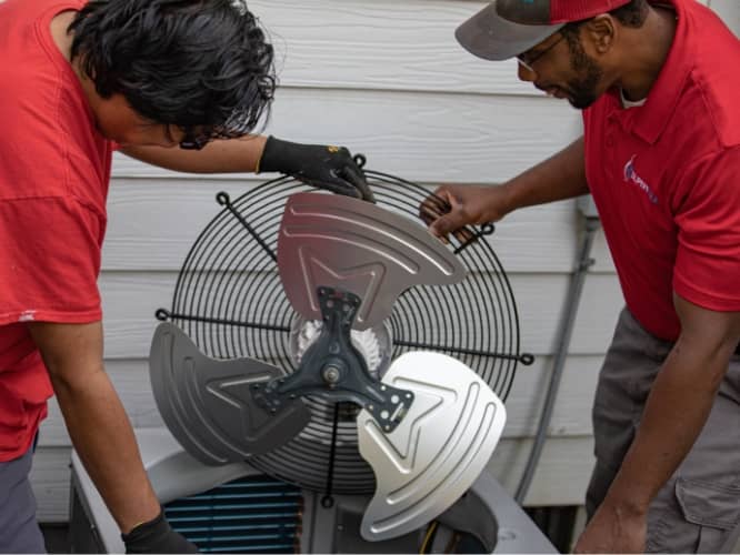 Employees working on fan