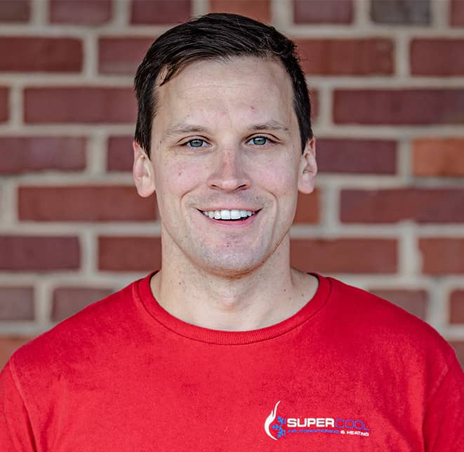 smiling man wearing red shirt